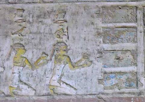 The two Drty (two kites), offering nw vases to the four pools. Relief from the tomb of Pahery in el-Kab. XVIII Dynasty. Ancient Egypt